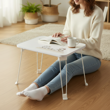 Woman Legs Stretched Forward Under Cat Table